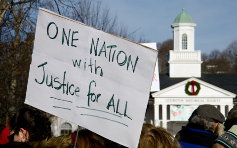 image of sign reading one nation with justice for all